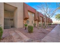 Modern apartment complex with well-maintained landscaping and inviting entrance at 5422 River Glen Dr # 373, Las Vegas, NV 89103
