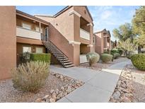 Apartment building with a well maintained walkway and landscaping at 555 E Silverado Ranch Blvd # 2114, Las Vegas, NV 89183