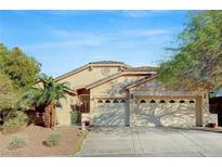 Charming single-story home with a well-manicured front yard and a two-car garage at 60 Mesa Rivera St, Henderson, NV 89012
