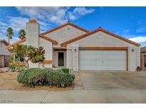 Charming single-story home features a well-maintained front yard and a two-car attached garage at 630 Otono Dr, Boulder City, NV 89005