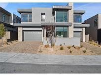 Contemporary two-story home showcasing modern design elements and a well-maintained front yard at 4880 Argento Peak St, Las Vegas, NV 89135