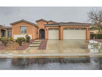 Charming single-story home with a three-car garage and well-maintained landscaping at 6065 Burleson Ranch Rd, Las Vegas, NV 89131