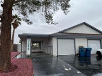 Charming single-story townhome with a well-maintained front yard and attached garage at 7046 Royal Meadow Pl, Las Vegas, NV 89147