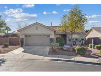 Charming single-story home with desert landscaping, a tile roof, and an attached two-car garage at 1047 Amber Gate St, Henderson, NV 89002