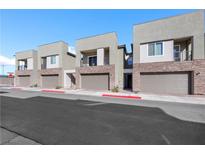 Modern townhome exteriors with stone accents and private balconies showcase contemporary design at 234 Walsh Peak Ave, Henderson, NV 89015