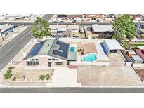 Charming property featuring a refreshing pool, covered parking, and solar panels for energy efficiency at 4414 E Baltimore Ave, Las Vegas, NV 89104