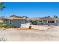 Charming single-story home with a well-maintained lawn and blue-painted exterior at 5350 Topaz St, Las Vegas, NV 89120