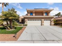 Charming home featuring a three-car garage, well-maintained landscaping, and a welcoming entrance at 8904 Saint Pierre Dr, Las Vegas, NV 89134