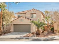 Charming two-story home features a well-maintained front yard and attached two-car garage at 9257 Harbor Stream Ave, Las Vegas, NV 89149