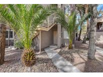 Inviting condo entrance with well-maintained landscaping and stairway to upper units at 5250 S Rainbow Blvd # 1165, Las Vegas, NV 89118