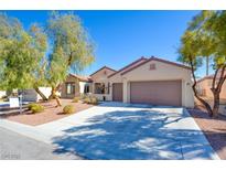 Charming single-story home featuring a two-car garage, desert landscaping, and a well-maintained front yard at 2132 Twin Falls Dr, Henderson, NV 89044