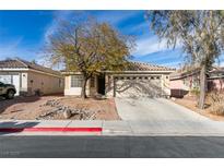 Charming single-story home with a well-maintained yard, concrete driveway, and an attached two-car garage at 5828 Sierra Medina Ave, Las Vegas, NV 89139