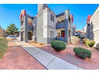 A well-maintained, multi-level condo building featuring landscaped grounds and a clean, modern design at 8600 W Charleston Blvd # 2086, Las Vegas, NV 89117