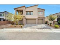 Beautiful two-story home with a three car garage and covered second story balcony at 10010 Desert Azure St, Las Vegas, NV 89178