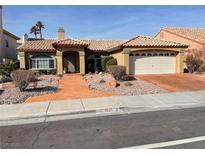 Charming single-story home featuring a tile roof, desert landscaping, and an attached two-car garage at 3625 N Campbell Rd, Las Vegas, NV 89129
