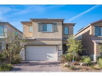 Charming two-story home with a two-car garage and a well-maintained front yard, perfect for suburban living at 3746 Bright Aquarius Ln, Henderson, NV 89052