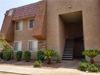 Exterior of a multi-unit building featuring a unique architectural design and manicured landscaping at 4965 Indian River Dr # 108, Las Vegas, NV 89103