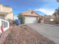 Charming single-story home featuring a two-car garage and low-maintenance landscaping at 7089 Orange Grove Ln, Las Vegas, NV 89119