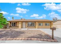 Charming single-story home with a well-maintained gravel front yard and a cozy feel at 7274 Pinebrook Cir, Las Vegas, NV 89147