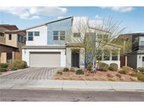 Stylish two-story home featuring a modern design, two-car garage, and well-maintained landscaping at 9690 Hiking Ave, Las Vegas, NV 89166