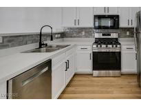 Modern kitchen features stainless steel appliances and stylish backsplash at 1800 N Jones Blvd, Las Vegas, NV 89108