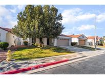 Charming single-story home with well-manicured lawn and mature tree in a quiet neighborhood at 1835 Swallow Hill Ave, Henderson, NV 89012