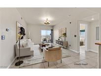 Bright living room features modern decor, stylish furnishings, and sliding glass doors to a balcony at 3550 Bay Sands Dr # 2087, Laughlin, NV 89029