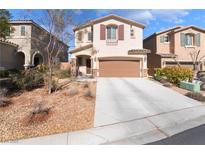 Inviting two-story home with a two-car garage and charming desert landscaping at 7722 Sagamore Bay Ct, Las Vegas, NV 89179