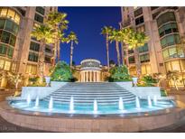 Beautiful water feature at night with palm trees and elegant architectural elements at 1 Hughes Center Dr # 308, Las Vegas, NV 89169