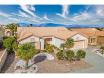 Charming single-story home with desert landscaping, tile roof, and mountain views at 10132 Cresent Creek Dr, Las Vegas, NV 89134