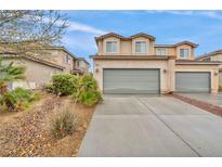 Charming two-story townhome featuring an attached two-car garage and low-maintenance landscaping at 3724 Thomas Patrick Ave, North Las Vegas, NV 89032