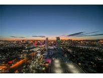 The aerial view showcases the Palms Casino Resort with the Las Vegas skyline during a vibrant sunset at 4381 W Flamingo Rd # 5708, Las Vegas, NV 89103