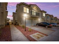 Charming townhouse featuring a private balcony, attached garage, and landscaped walkway at 6201 E Lake Mead Blvd # 156, Las Vegas, NV 89156