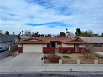 Charming single-story home featuring a two-car garage and well-kept front yard at 6216 Bullion Blvd, Las Vegas, NV 89103