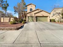 Charming two-story home with a well-manicured front yard and attached two car garage at 6330 W Azure Dr, Las Vegas, NV 89130