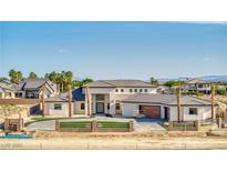 Stunning single-Gathering home with a modern design, beautiful landscaping, and a spacious driveway at 6383 Horse Dr, Las Vegas, NV 89131