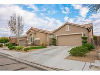 Charming single-story stucco home with a well-manicured lawn and two-car garage at 10217 Queens Church Ave, Las Vegas, NV 89135