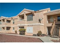 Exterior building with stairwell, windows, desert landscaping under blue sky at 1830 N Pecos Rd # 137, Las Vegas, NV 89115