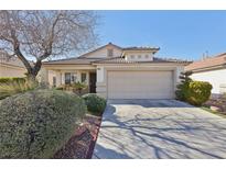 Charming single-story home featuring a well-maintained lawn and a two-car garage at 3805 Sorrowing Sparrow Ct, North Las Vegas, NV 89032