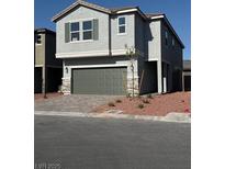 Charming two-story home featuring a well-maintained yard and attached two-car garage at 6616 Bowery St, Las Vegas, NV 89148