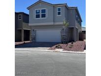 Charming two-story home featuring a two-car garage and a well-maintained front yard at 6616 Bowery St, Las Vegas, NV 89148