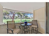 Enjoy the covered patio with views of the golf course and mature trees at 668 Oakmont Ave # 1724, Las Vegas, NV 89109