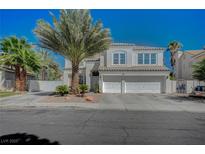 Charming two-story home featuring desert landscaping and a three-car garage at 7650 Hartwell Dr, Las Vegas, NV 89123