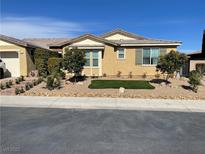 Charming single-story home featuring desert landscaping with a small patch of green grass at 9240 Northfield Park Ct, Las Vegas, NV 89148