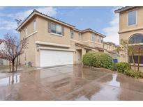 Two-story home with a spacious driveway and well-maintained landscaping at 9278 Hainsworth Ave, Las Vegas, NV 89148