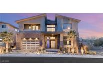 Stunning two-story modern home with sleek lines, desert landscaping, and a welcoming entrance at 10632 Patina Hills Ct, Las Vegas, NV 89135