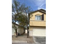 Two story home with an attached two car garage and simple landscaping at 4356 Pittsfield St, Las Vegas, NV 89115