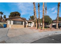 Charming single-story home featuring stone accents, desert landscaping, and a spacious driveway at 5111 Rudy Ln, Las Vegas, NV 89120