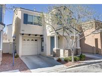 Charming two-story home featuring a one car garage, covered entry, and landscaped front yard at 8235 Misty Sage St, Las Vegas, NV 89139