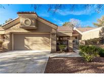 Charming single-story home featuring a two-car garage, well-maintained landscaping, and a walkway leading to the entrance at 8920 Litchfield Ave, Las Vegas, NV 89134
